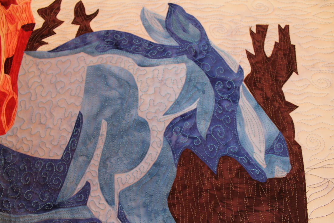 Free motion stitching on moose quilt